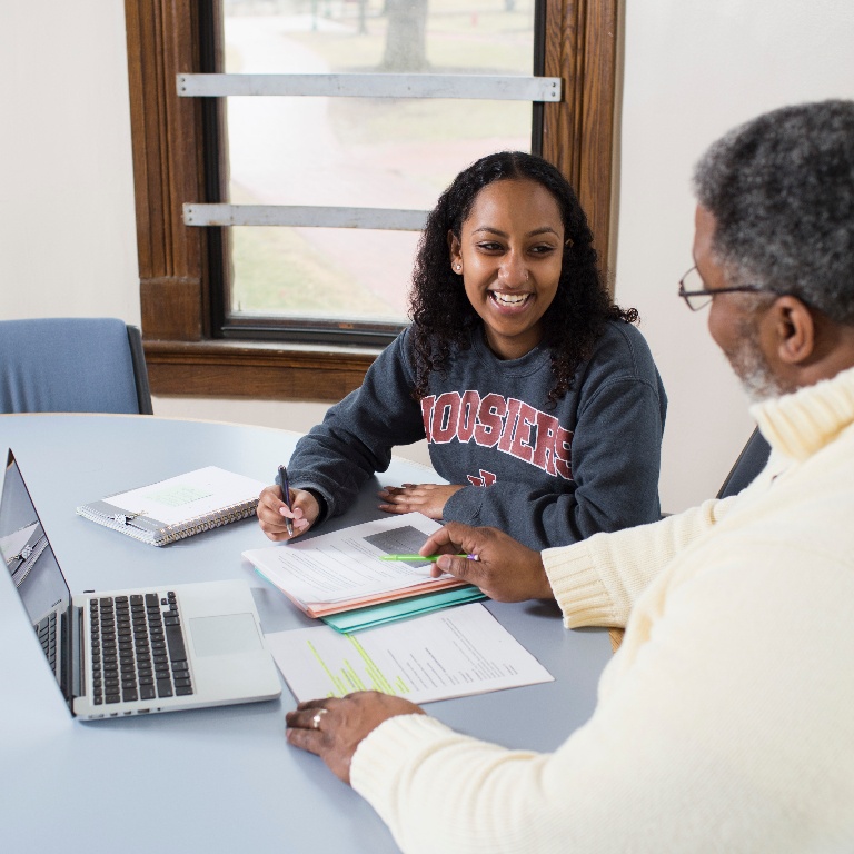 Student meets with a Groups Program academic advisor in Maxwell Hall